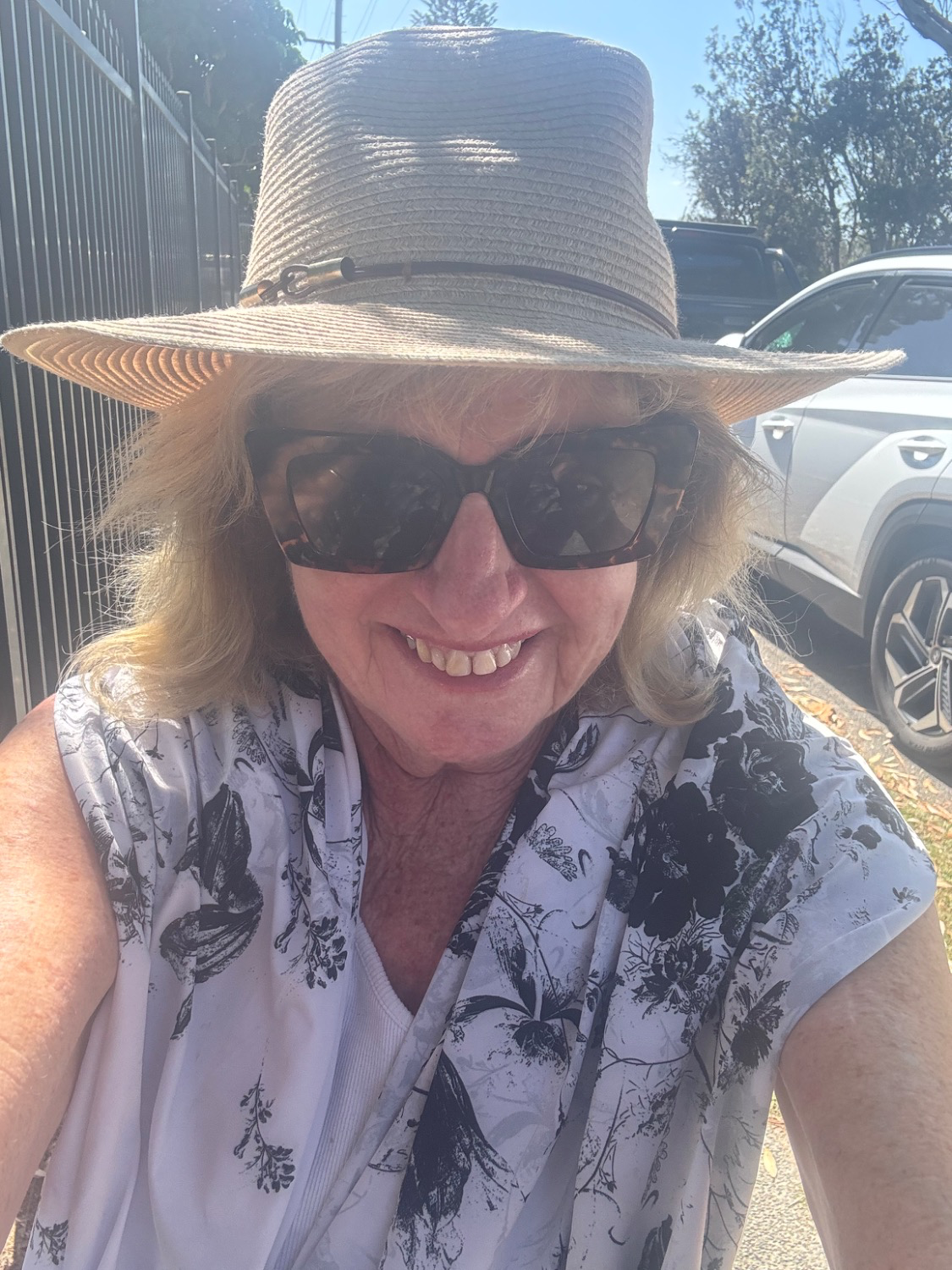 Bernadette wearing Midnight Blossoms Sun Wrap