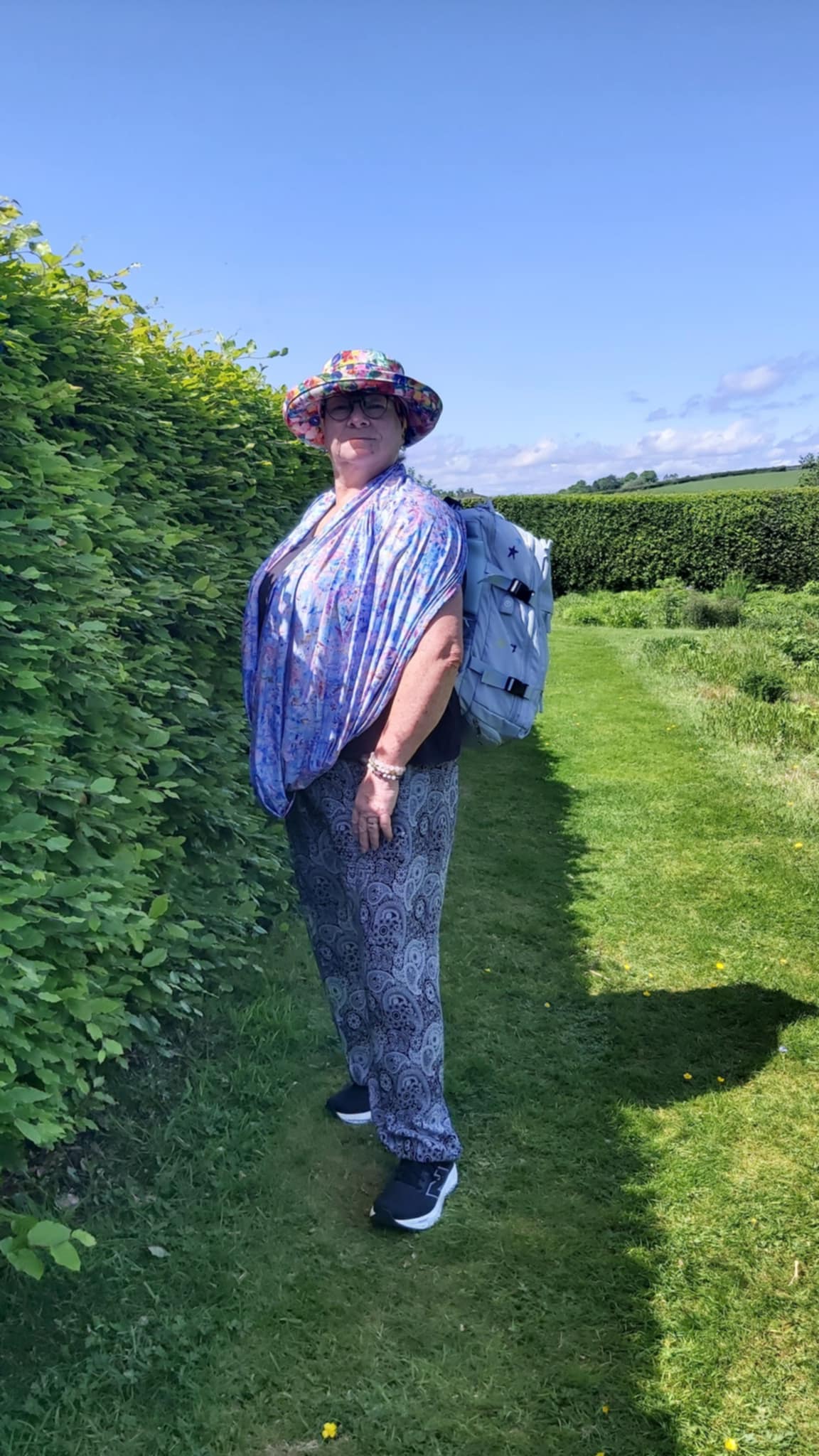 Caron wearing Jacaranda Sun Wrap