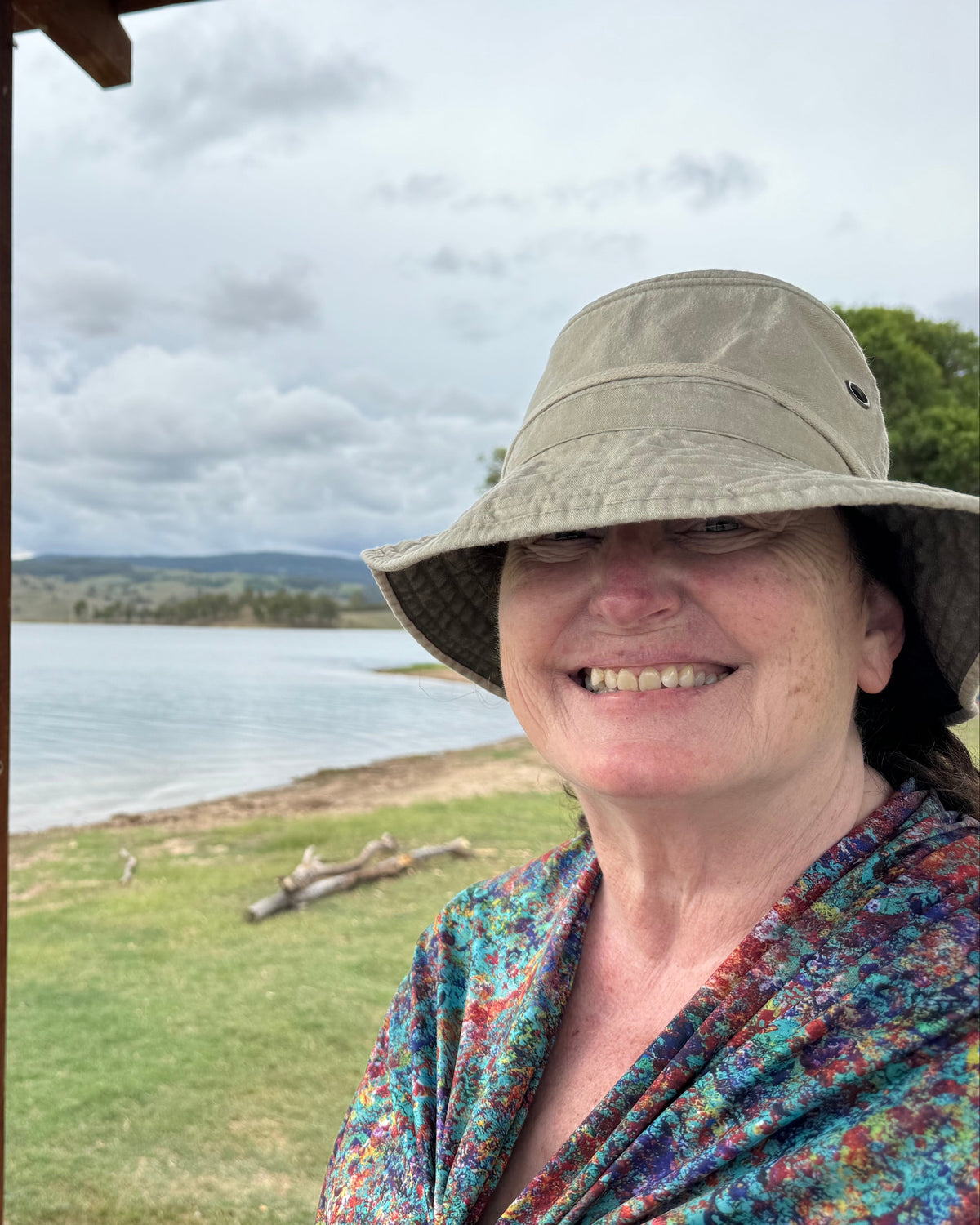 Sarah wearing the Rainbow Bee Eaters Sun Wrap in M/L